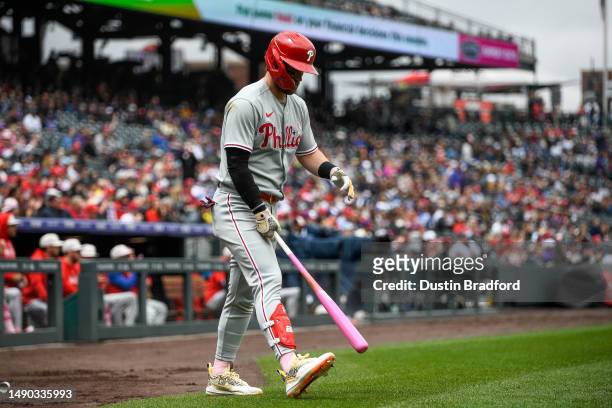 Bryce Harper of the Philadelphia Phillies warms up before batting in the first inning of a game against the Colorado Rockies at Coors Field on May...