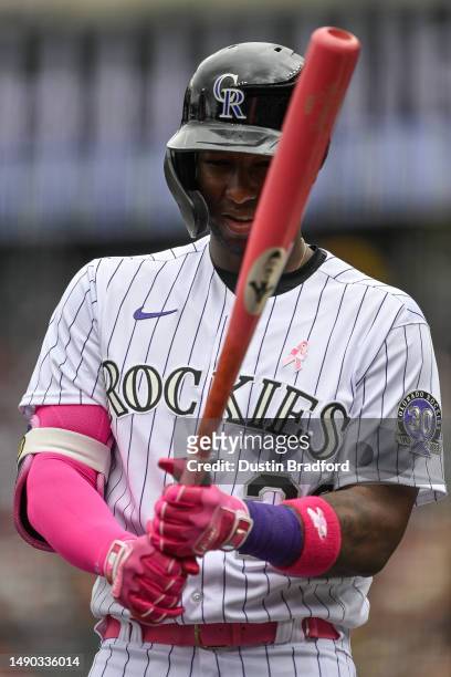 Jurickson Profar of the Colorado Rockies warms up before batting against the Philadelphia Phillies in the first inning of a game at Coors Field on...