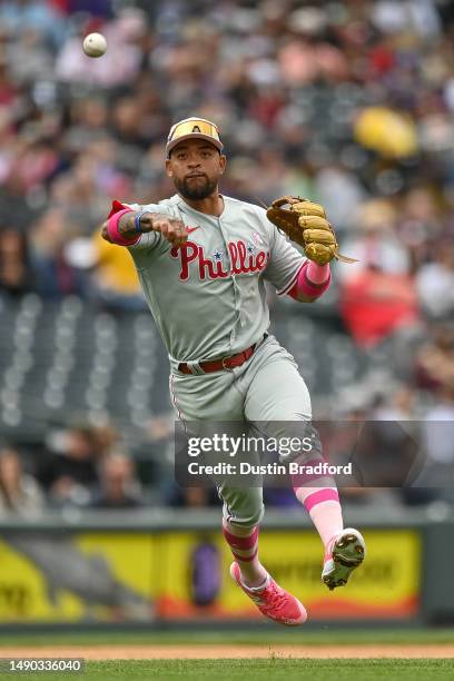 Edmundo Sosa of the Philadelphia Phillies throws to first base after fielding a ground ball in the fourth inning of a game against the Colorado...