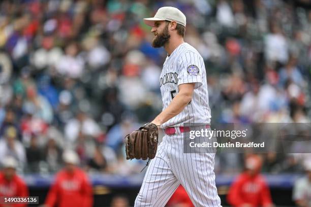 Jake Bird of the Colorado Rockies walks off the field after the final out of the top of the seventh inning of a game against the Philadelphia...