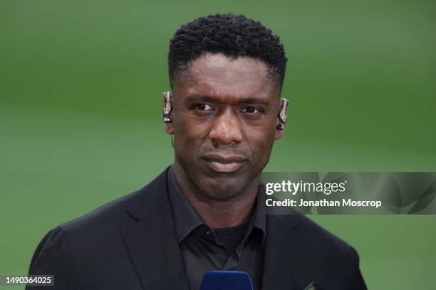 Former Midfielder Clarence Seedorf reacts as he comments for Amazon Prime prior to the UEFA Champions League semi-final first leg match between AC...