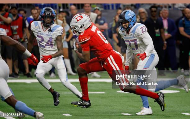 Josh Hammond of the DC Defenders runs for yardage against the Arlington Renegades during the second half of XFL Championship game at the Alamodome on...