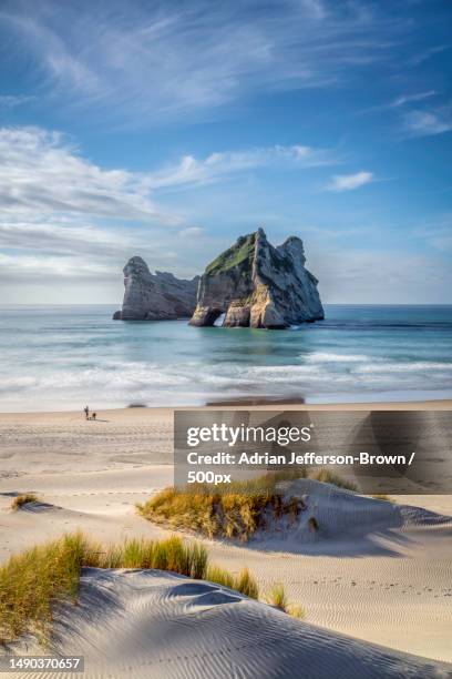 wharariki beach,new zealand - new zealand landscape stock pictures, royalty-free photos & images