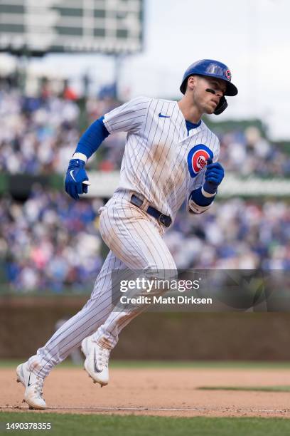 Nico Hoerner of the Chicago Cubs rounds third base in a game against the Los Angeles Dodgers at Wrigley Field on April 21, 2023 in Chicago, Illinois.