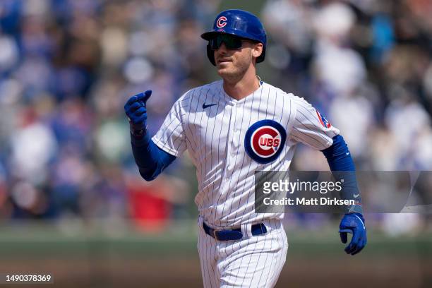 Cody Bellinger of the Chicago Cubs celebrates a home run in a game against the Los Angeles Dodgers at Wrigley Field on April 21, 2023 in Chicago,...