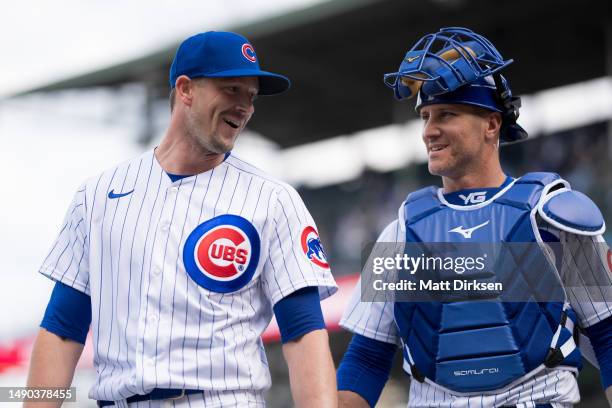 Drew Smyly and Yan Gomes of the Chicago Cubs laugh as they exit the field of play in a game against the Los Angeles Dodgers at Wrigley Field on April...