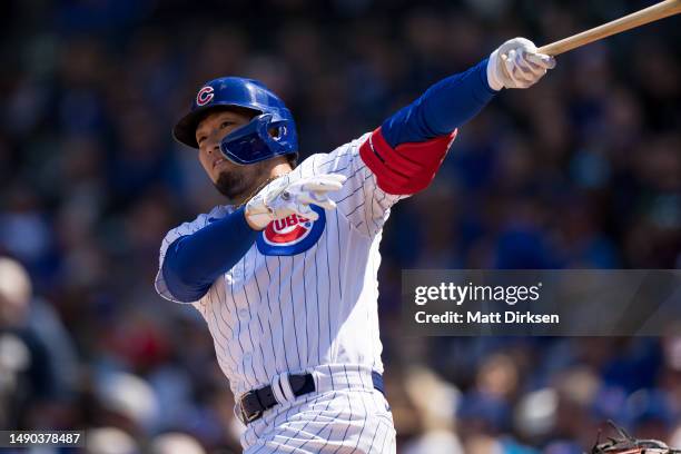 Seiya Suzuki of the Chicago Cubs watches the flight of the ball in a game against the Los Angeles Dodgers at Wrigley Field on April 21, 2023 in...