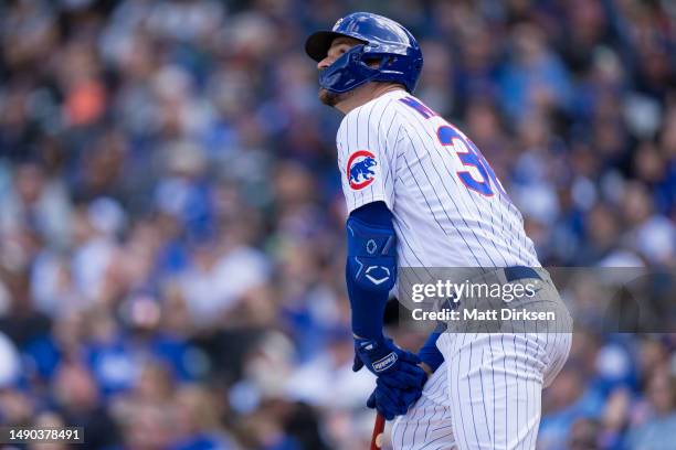 Trey Mancini of the Chicago Cubs hits a home run in a game against the Los Angeles Dodgers at Wrigley Field on April 21, 2023 in Chicago, Illinois.