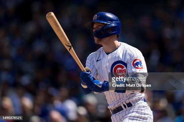Nico Hoerner of the Chicago Cubs watches the flight of the ball in a game against the Los Angeles Dodgers at Wrigley Field on April 21, 2023 in...