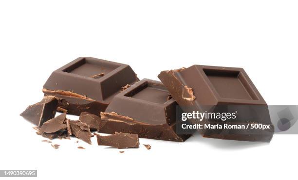 broken black chocolate with pieces isolated on white background dessert bar of chocolate,close up,romania - dark chocolate on white stock pictures, royalty-free photos & images