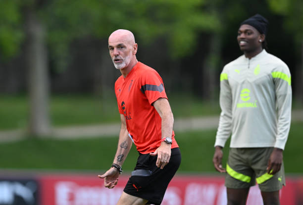 Head coach AC Milan Stefano Pioli and Rafael Leao of AC Milan look on during training session ahead of their UEFA Champions League semi-final second...