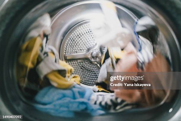 a washing or a drying machine operating - washing machine with bubbles stock pictures, royalty-free photos & images