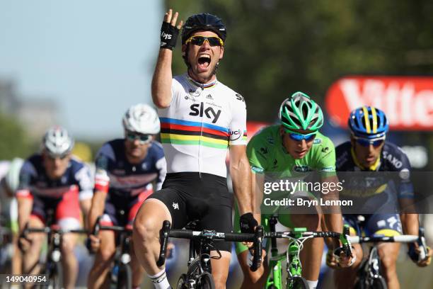 Mark Cavendish of SKY Procycling celebrates as he crosses the finish line to win the bunch sprint during the twentieth and final stage of the 2012...