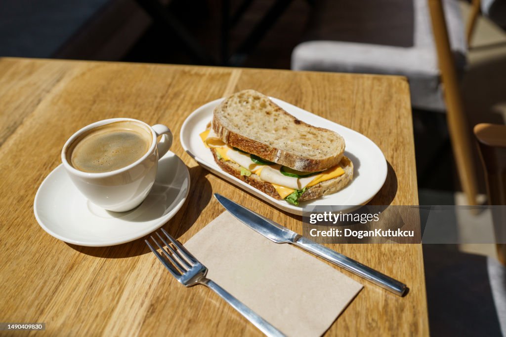 Coffee and sandwich , breakfast