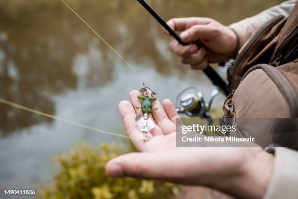 fishing lure - vishaak visgerei stockfoto's en -beelden
