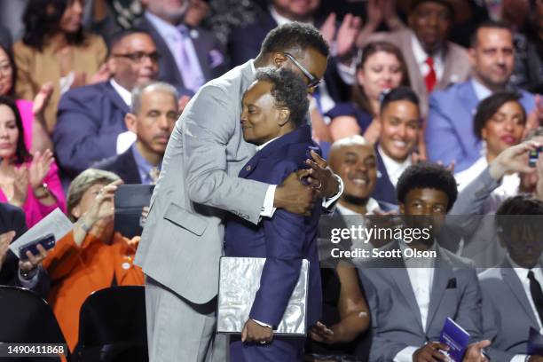 Incoming Chicago Mayor Brandon Johnson is greeted by outgoing Mayor Lori Lightfoot at his inauguration ceremony on May 15, 2023 in Chicago, Illinois....