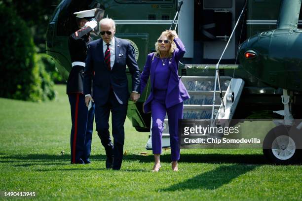 President Joe Biden and first lady Jill Biden step off of Marine One as they return to the White House on May 15, 2023 in Washington, DC. The Bidens...