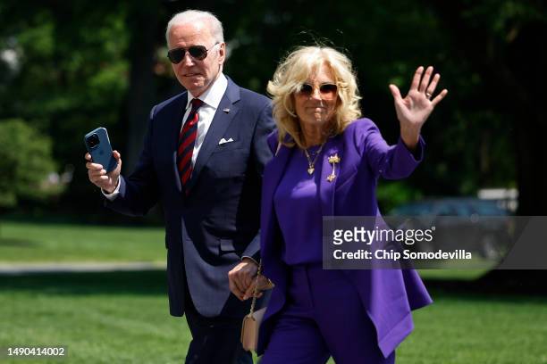 President Joe Biden and first lady Jill Biden walk across the South Lawn as they return to the White House on May 15, 2023 in Washington, DC. The...