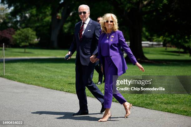 President Joe Biden and first lady Jill Biden return to the White House on May 15, 2023 in Washington, DC. The Bidens attended their granddaughter...