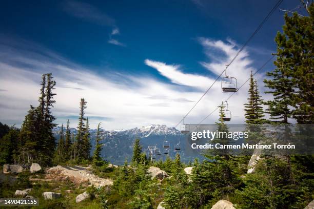 chair lift for the ski runs at whistler peak in british columbia, canada - sports 2016 stock pictures, royalty-free photos & images