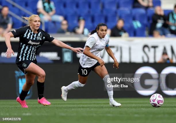 Marta of the Orlando Pride and Allie Long of the NJ/NY Gotham FC fight for the ball in the second half at Red Bull Arena on May 14, 2023 in Harrison,...