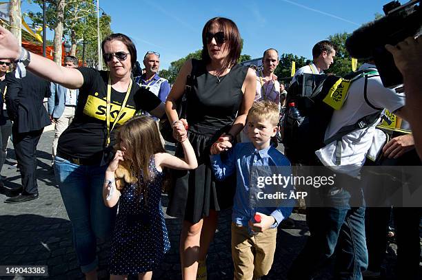 Catherine Wiggins , the wife of Tour de France 2012 winner, Yellow jersey British Bradley Wiggins, arrives with their children on the Champs-Elysees...