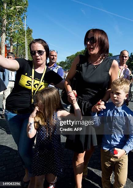 Catherine Wiggins , the wife of Tour de France 2012 winner, Yellow jersey British Bradley Wiggins, arrives with their children on the Champs-Elysees...