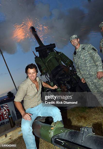 Recording Artist Easton Corbin fires a Howitzer 105mm cannon with the help of the Wisconsin National Guard at Country Thunder - Day 3 on July 21,...