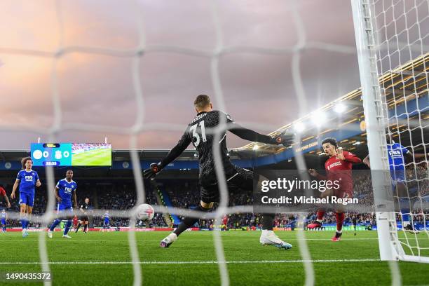 Curtis Jones of Liverpool scores the team's first goal past Daniel Iversen of Leicester City during the Premier League match between Leicester City...