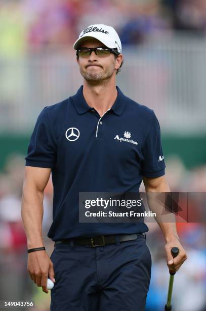 Adam Scott of Australia reacts to a missed par putt on the 18th green during the final round of the 141st Open Championship at Royal Lytham & St....