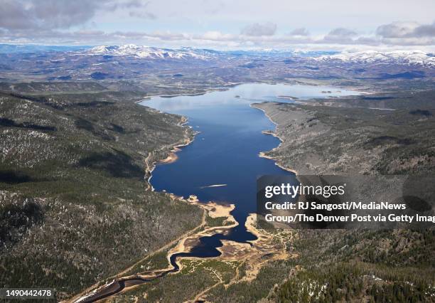 Water in Shadow Mountain Lake continues into the Colorado River and flows into Lake Granby to the south on May 13, 2023 near Granby, Colorado. The...