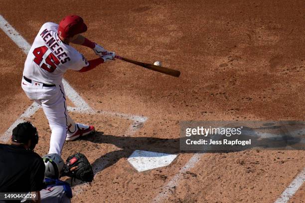 Joey Meneses of the Washington Nationals hits a RBI-double against the New York Mets during the third inning at Nationals Park on May 15, 2023 in...