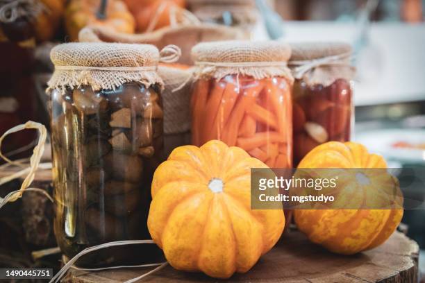 pickles pumpkin in an autumn rustic jar - canning stock pictures, royalty-free photos & images