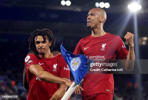 Trent Alexander-Arnold of Liverpool celebrates with Fabinho after scoring the team's third goal during the Premier League match between Leicester...