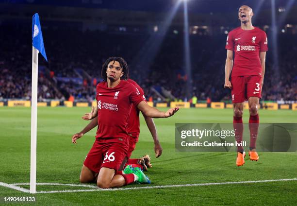 Trent Alexander-Arnold of Liverpool celebrates with Fabinho after scoring the team's third goal during the Premier League match between Leicester...