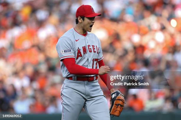 Starting pitcher Shohei Ohtani of the Los Angeles Angels reacts after the final out of the first inning against the Baltimore Orioles at Oriole Park...