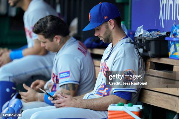 David Peterson of the New York Mets looks at an iPad in the dugout during the fifth inning against the Washington Nationals at Nationals Park on May...