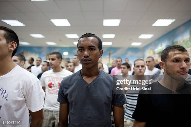 Israeli army recruits, after reporting for the draft at the Tel Hashomer induction centre on July 22, 2012 near Tel Aviv, Israel. Defense Minister...