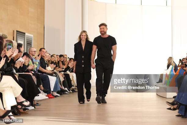 Designers Edwina Forest and Adrian Norris thank the audience following the Aje show during Afterpay Australian Fashion Week 2023 at the Sydney Modern...