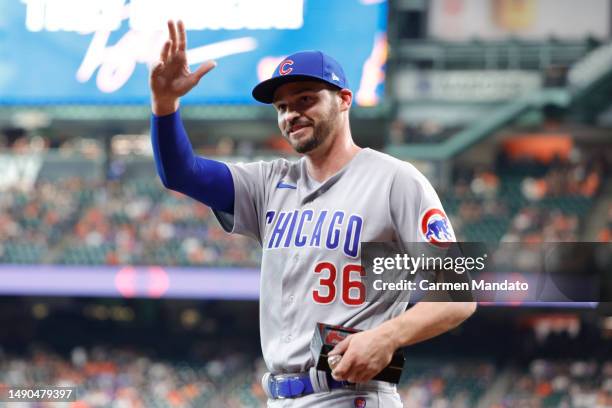 Trey Mancini of the Chicago Cubs receives his World Series ring from Dusty Baker Jr. #12 of the Houston Astros at Minute Maid Park on May 15, 2023 in...