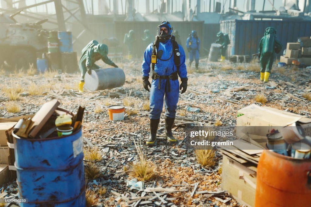 Men in hazmat suit cleaning polluted environment