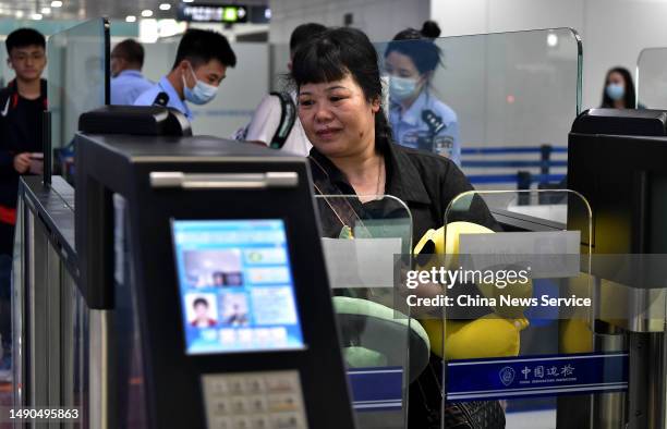 Travelers pass through immigration checkpoints at Fuzhou Changle International Airport on May 15, 2023 in Fuzhou, Fujian Province of China. Fast-lane...