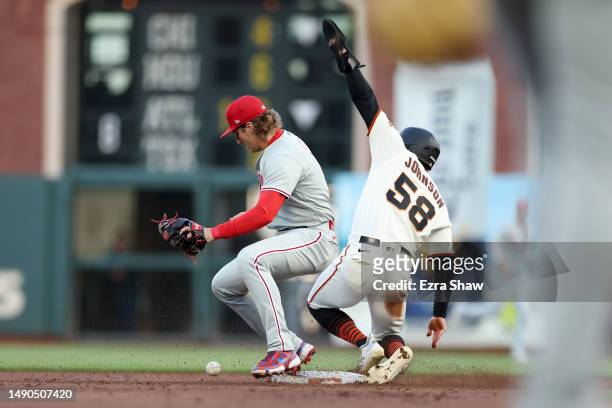 Bryce Johnson of the San Francisco Giants is safe at second base on an error by Bryson Stott of the Philadelphia Phillies in the second inning at...