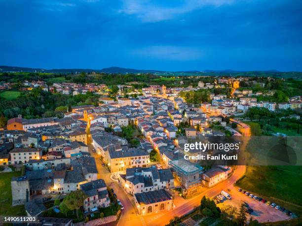 asciano tuscan town at dusk - asciano stockfoto's en -beelden