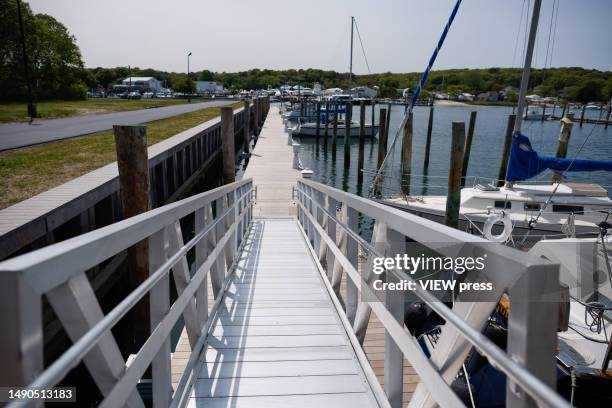 Boats docketed on Meschutt Beach are seen on May 15, 2023 in Hampton Bays New York. Long Island is getting ready to open business for the Summer...