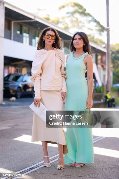 Lissy Graham wearing Bianca Spender dress, Hermes white clutch and Celine shoes and Chelsea Graham wearing Bianca Spender dress and Tory Burch green...