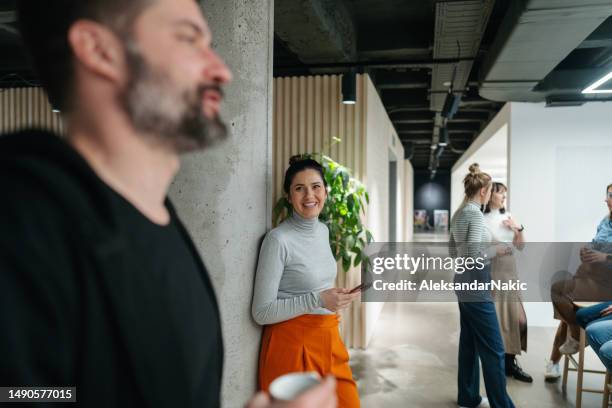 colleagues taking a coffee break in the office cafeteria - business meeting coffee stock pictures, royalty-free photos & images