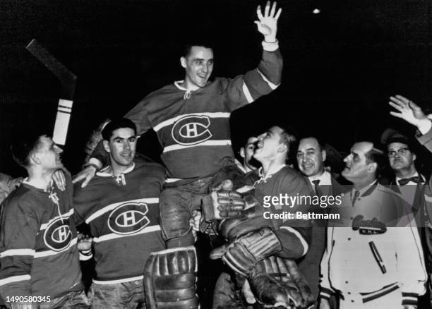 Goaltender Jacques Plante is celebrated by Montreal Canadiens team mates after beating the Boston Bruins 5-1 in the Stanley Cup Finals at the...