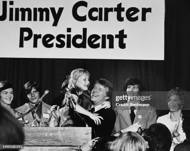 Jimmy Carter, Governor of Georgia, holds up his daughter Amy as he announced that he is to seek the Democratic presidential nomination, Atlanta,...