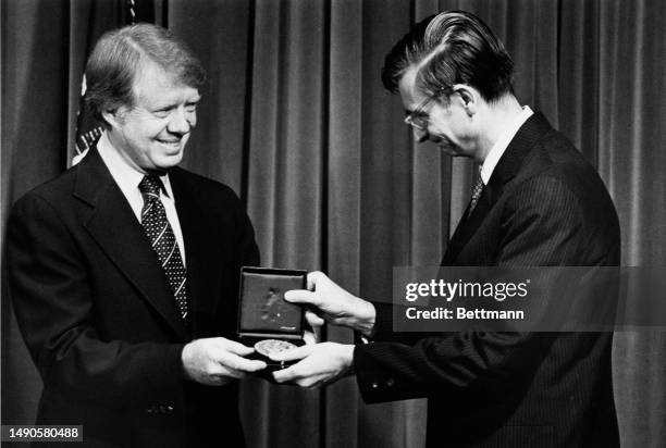 President Jimmy Carter presents a National Medal of Science to biologist Edward O Wilson , chairman of the Center for Environmental and Behavioral...